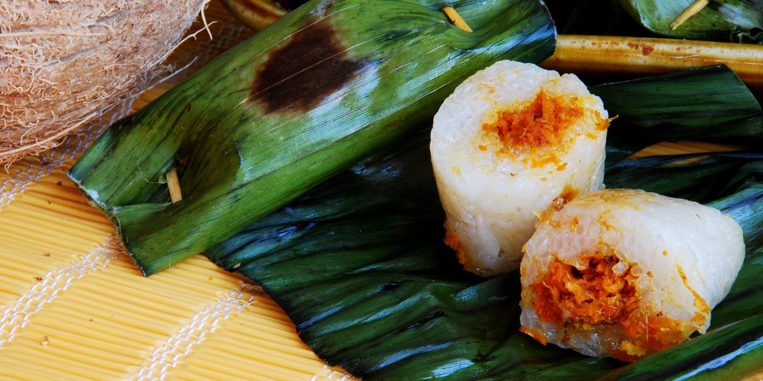 Pulut Panggant (Sweet rice with coconut and shrimp and wrapped in ...