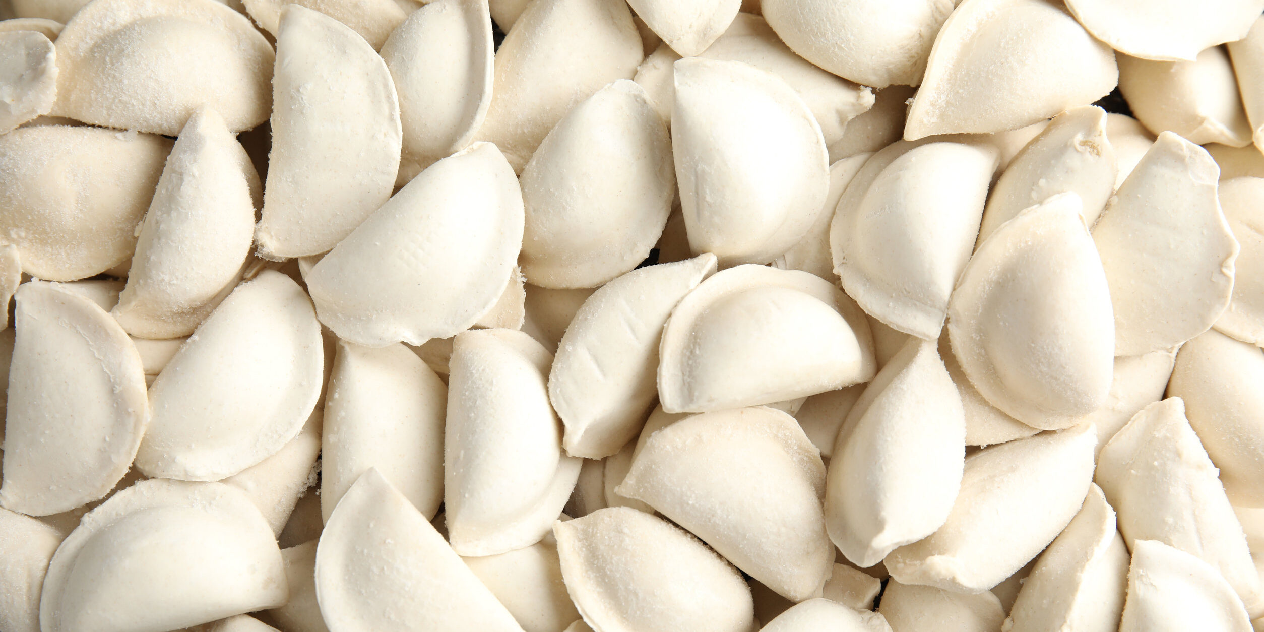 Raw dumplings as background, top view. Home cooking